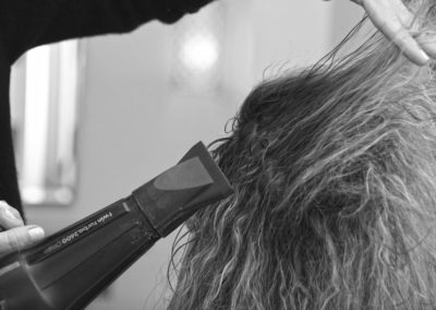 woman's hair being styled